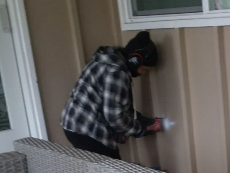 Professional electrician installing an exterior outlet in Middleton