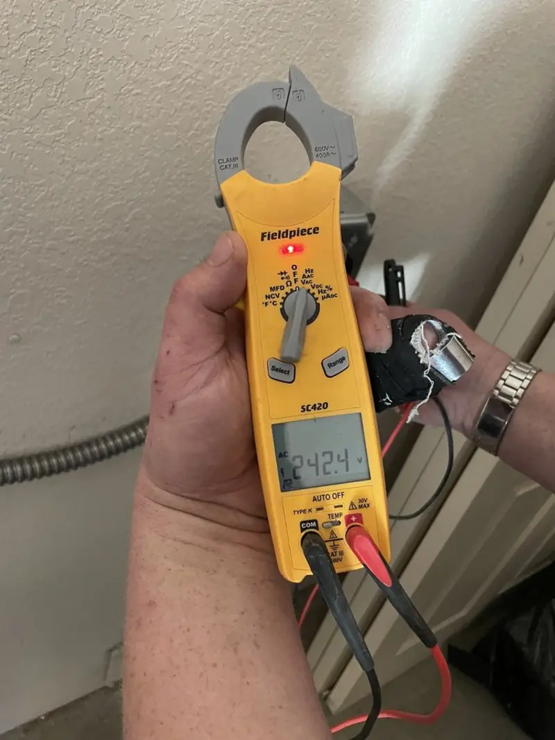 Voltage testing with clamp meter during Recessed Lighting Installation in Middleton